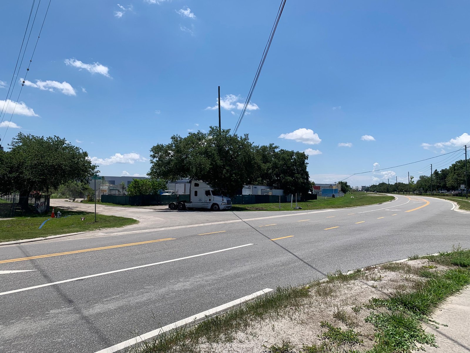 View of parking lot road entrance from Boggy Creek Rd